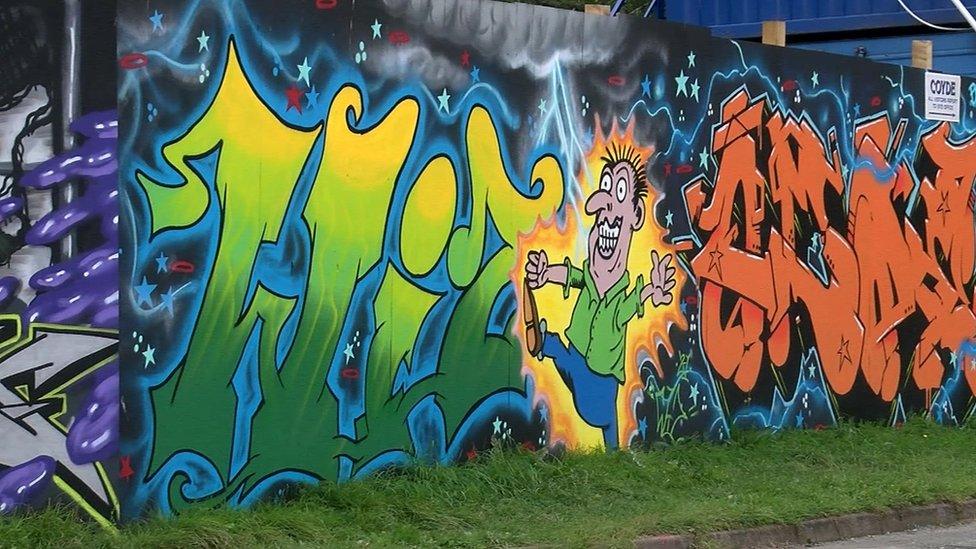 Street art design appears on construction board