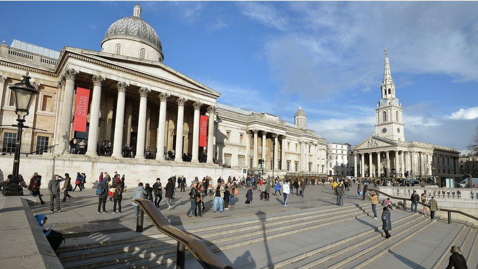 photograph shows the outside of the national gallery in london