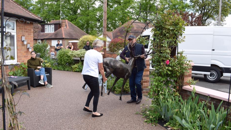 Villagers return stag