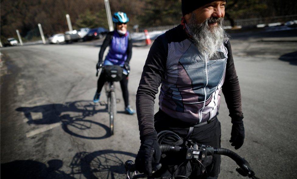 Guido Huwiler and his wife Rita Ruettimann on their bikes