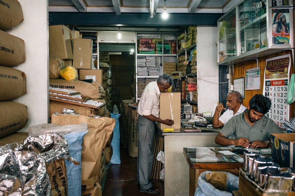 Workers work in a tea shop in Kandy