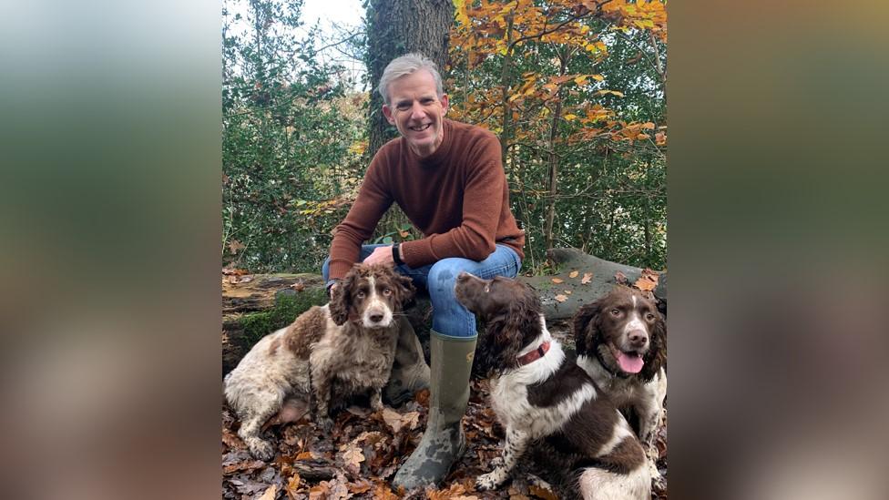 Vet Edward Davies with three dogs