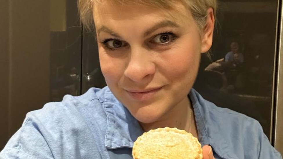 Julie Pickering holding a mince pie