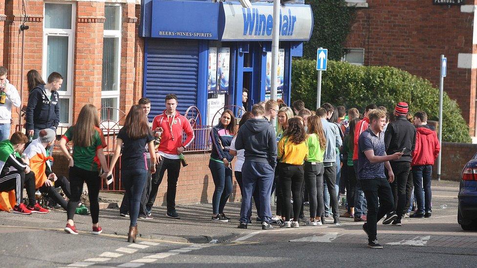 Students began queuing at an off-licence in the Holyland on Thursday morning