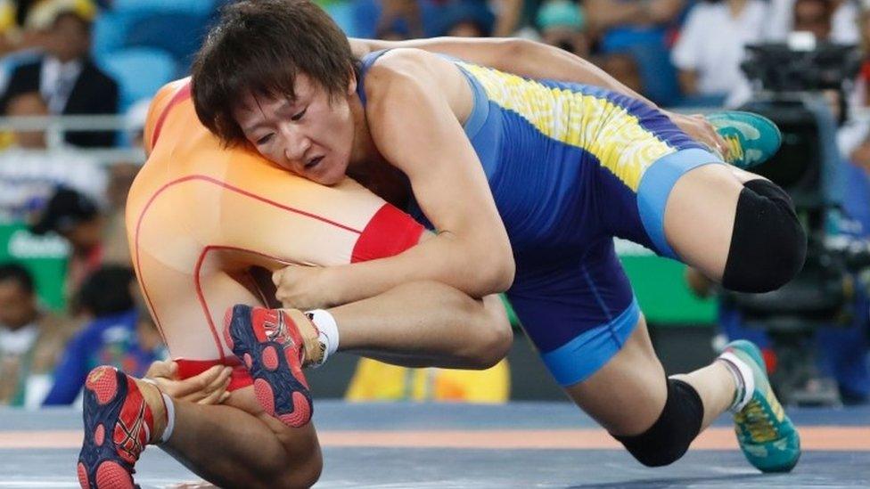 India"s Sakshi Malik (red) wrestles with Kirghyzstan"s Aisuluu Tynybekova in their women"s 58kg freestyle bronze medal match on August 17, 2016,