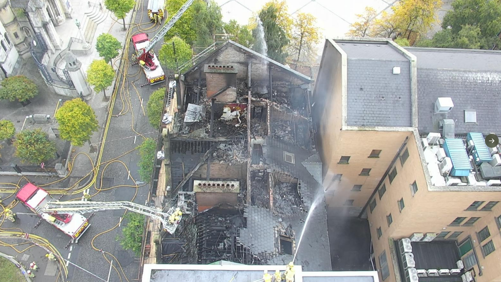 An aerial view of the damage to the top of the roof