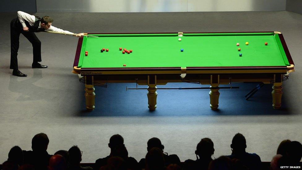 Mark Selby plays a shot against Ronnie O'Sullivan during The Dafabet World Snooker Championship final at Crucible Theatre on May 4, 2014 in Sheffield, England