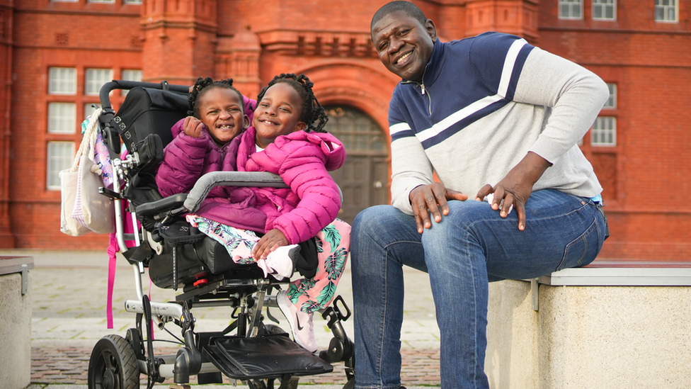 Ibrahima Ndiaye and his daughters Marieme and Ndeye