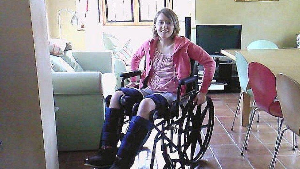 Author Emily Koch in a wheelchair after her accident