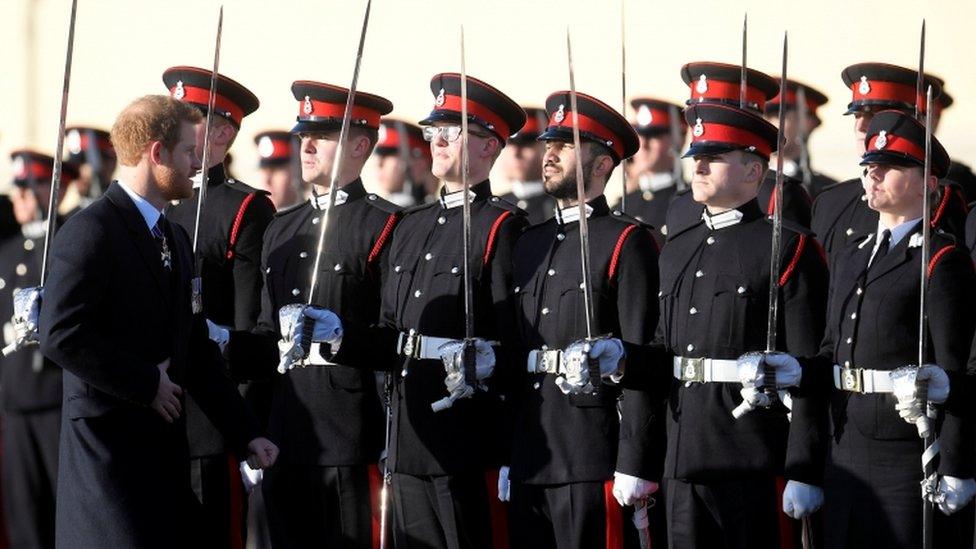 Prince Harry inspects the officer cadets at the Sovereign's Parade