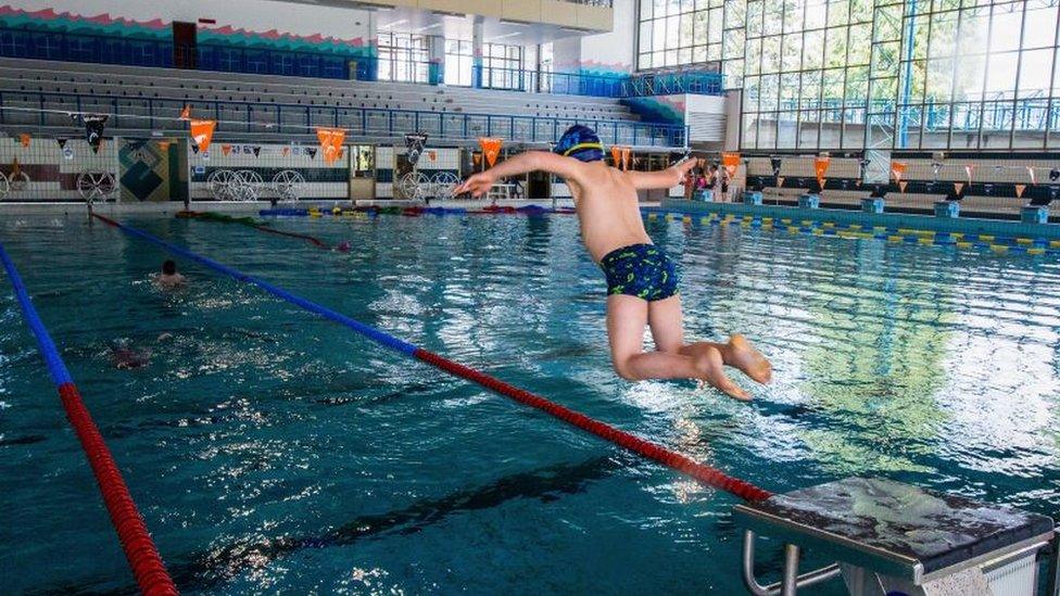 boy-jumping-in-the-water