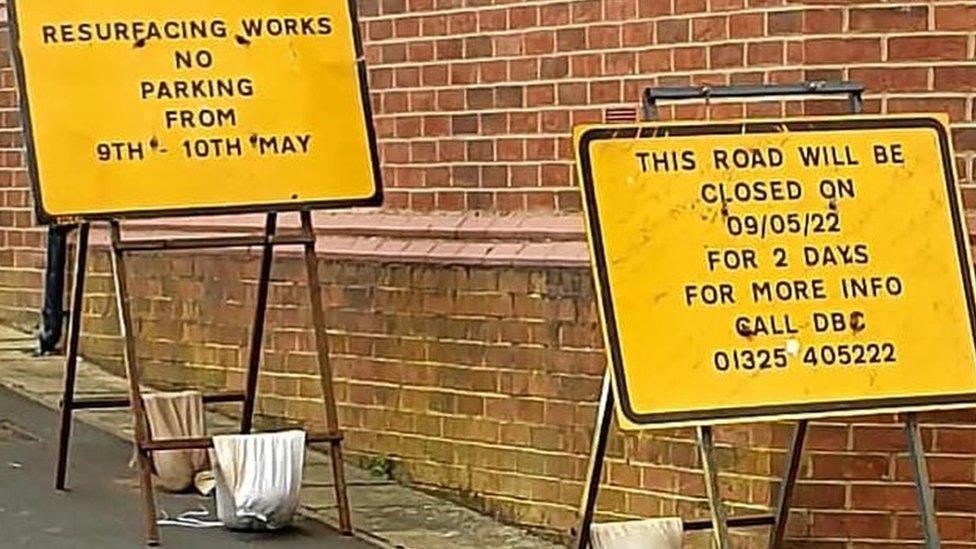 Signs warning motorists of the resurfacing works