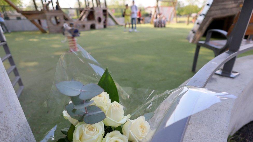 White roses are seen at the children's playground