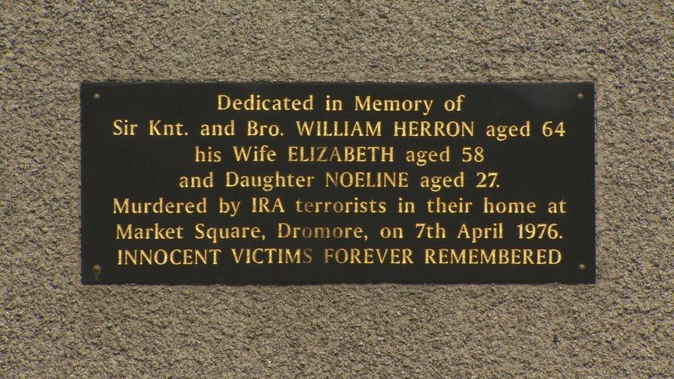 A plaque in memory of the murdered family