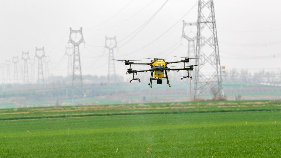 A drone flying over a field