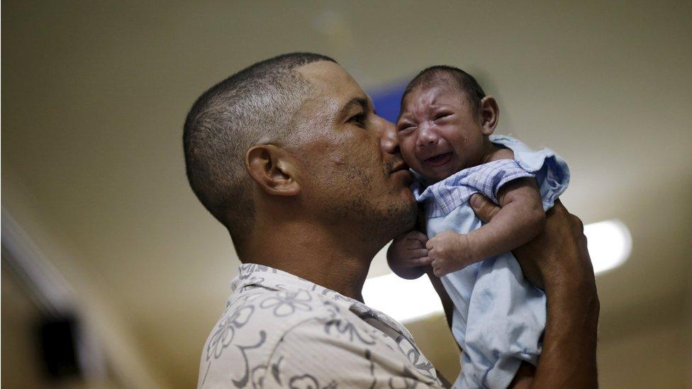 Geovane Silva holds his son Gustavo Henrique, who has microcephaly, at the Oswaldo Cruz Hospital in Recife, Brazil