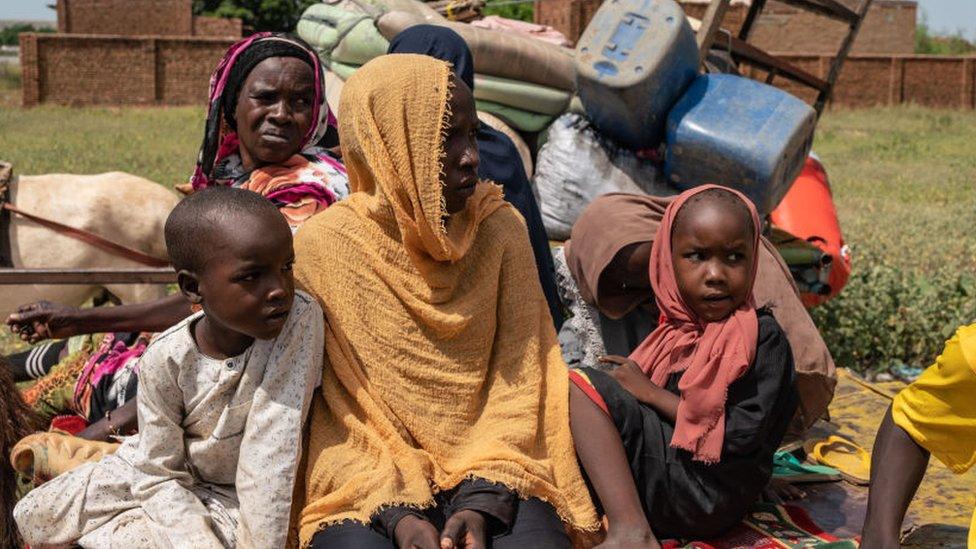 A Sudanese family on a cart