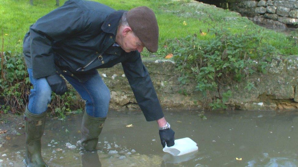 John taking a sample