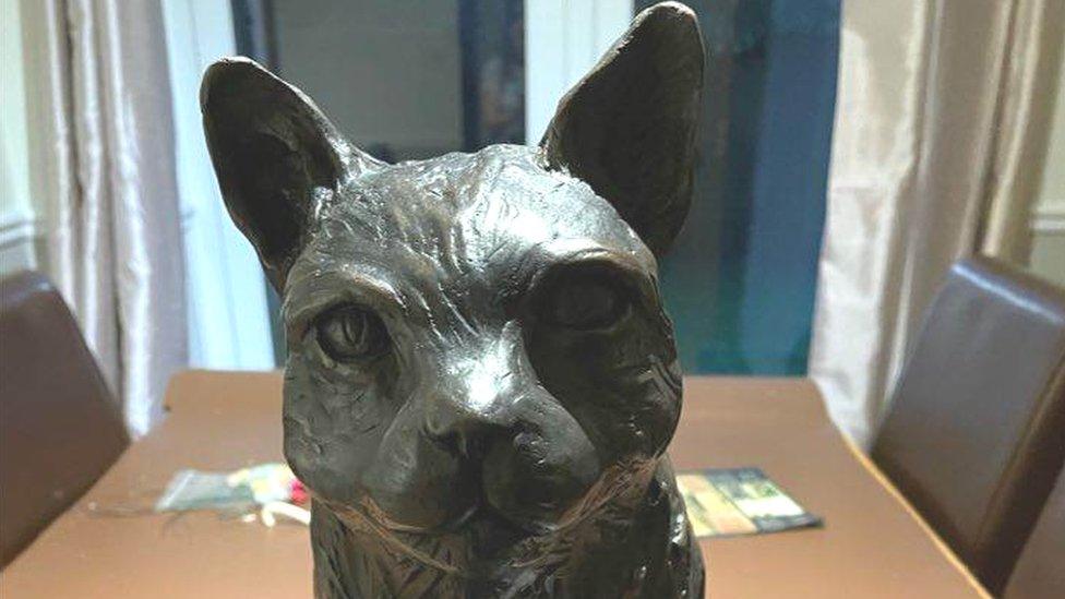 Bronze sculpture of a cat