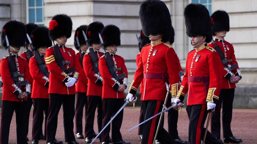 Soldiers from the 1st Battalion Coldstream Guards take part in the Changing of the Guard in the forecourt of Buckingham Palace