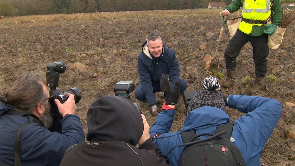 Photographers taking photos of Derek Mackay