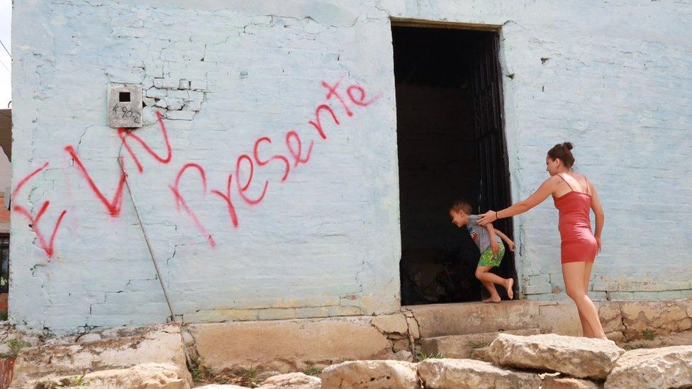 A wall of a house marked with graffiti of the ELN guerrilla group