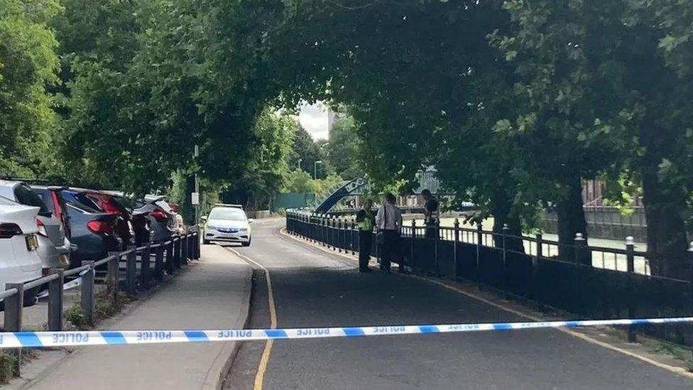 Police cordon on riverside