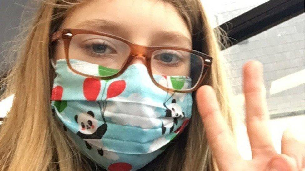 Girl wearing mask and glasses