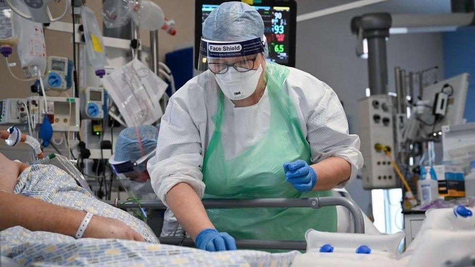 Nurse helping hospital patient