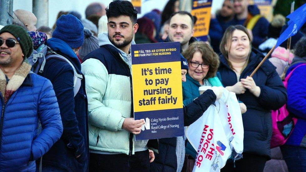 Members of the Royal College of Nursing (RCN) on the picket line outside the RCN offices by the University Hospital of Wales in Cardiff