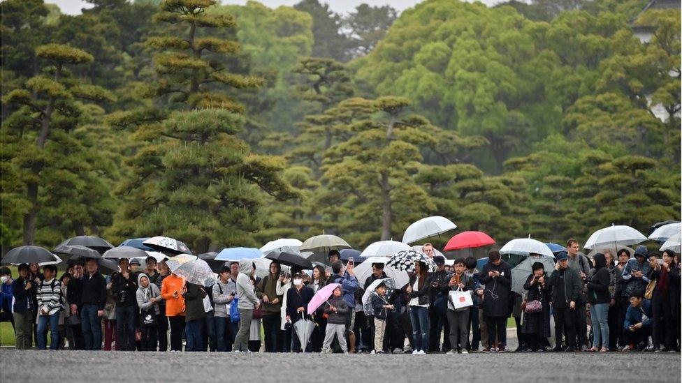 People outside the Imperial Palace in Tokyo