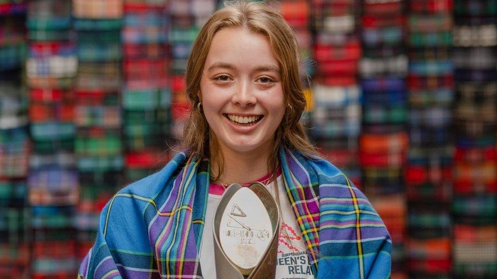 Baton bearer Alice Milivoyevich wears the Team Scotland 2022 tartan at the Lochcarron of Scotland visitor centre, Selkirk