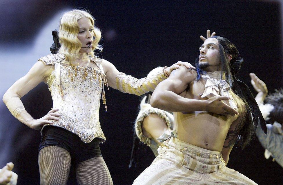 Madonna performs onstage during her 'Re-Invention' World Tour 2004 in California