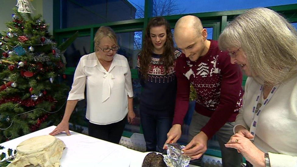 Testing the Christmas pudding (Christine Dodd on left)