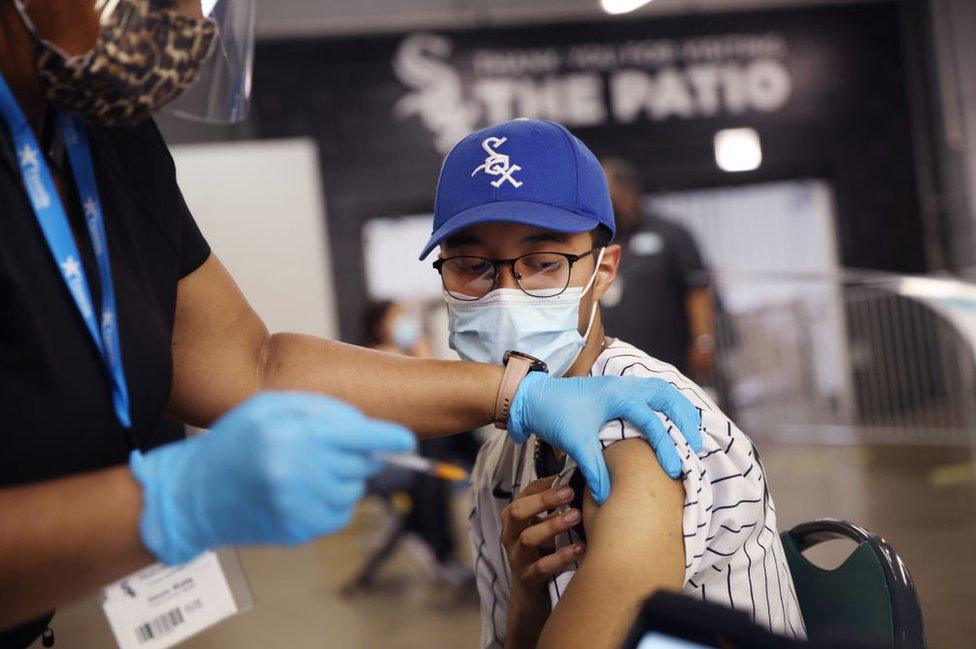 A young Chicago White Sox baseball fan get jabbed at a game