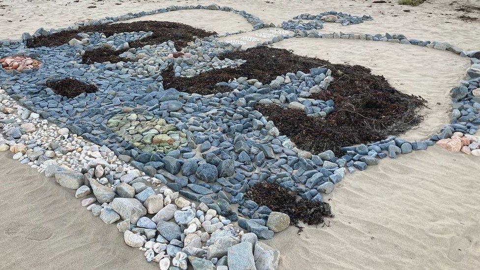 Tribute on a beach in Guernsey