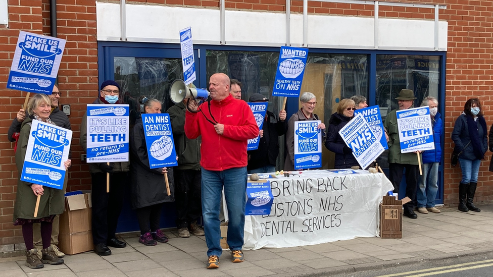 Protestors outside a building in Leiston, Suffolk