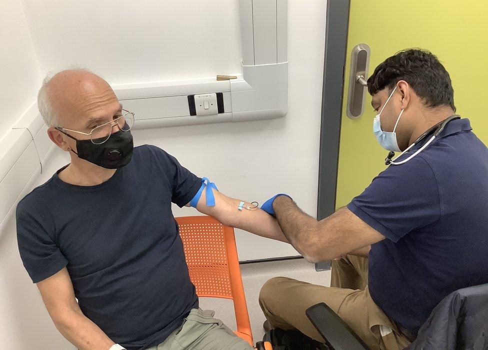 A volunteer having a blood sample taken at the vaccine trial clinic