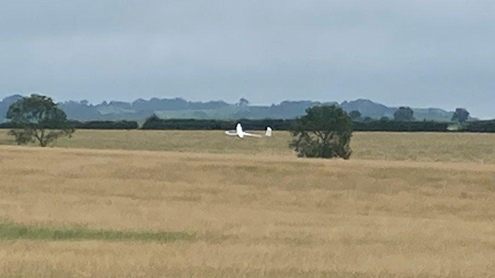 Crashed glider in field