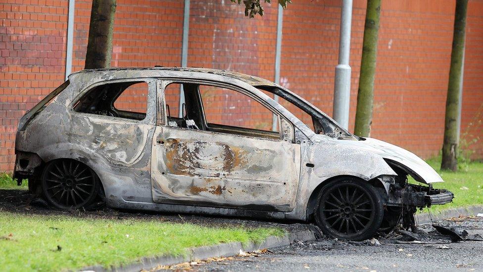 One of the two cars destroyed in the attacks on Monday afternoon