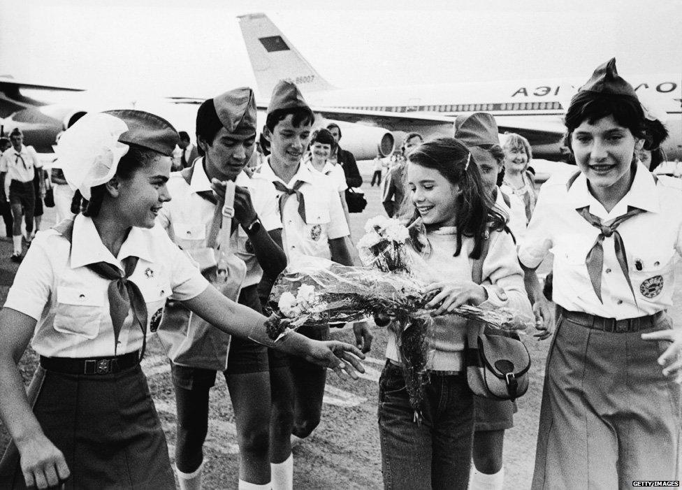 Schoolgirl Samantha Smith (1972 - 1985) (second right) is greeted by Russian Young Pioneers at the airport, Crimean Peninsula, Russia