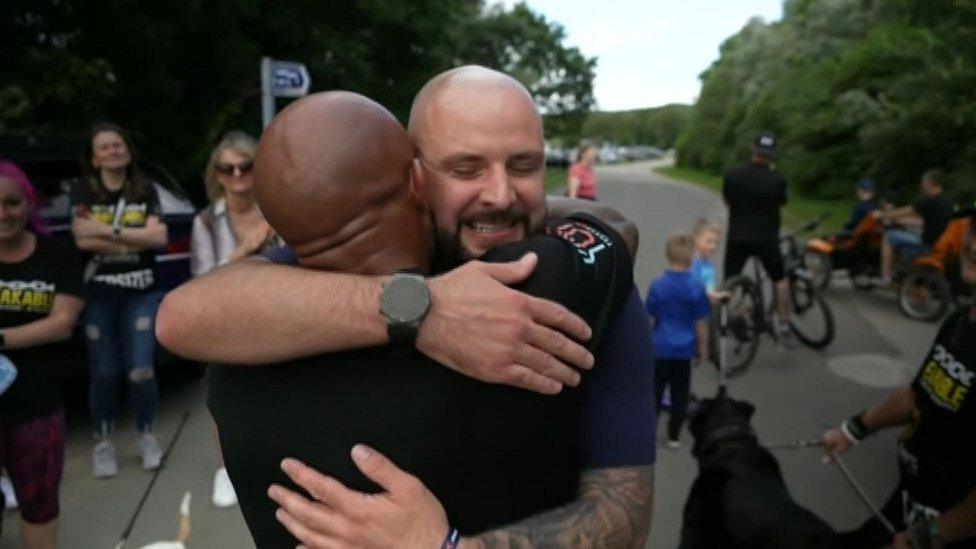 Jason Bennett hugs Lee Freeman on the finish line