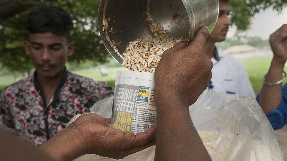 Eating jhal muri