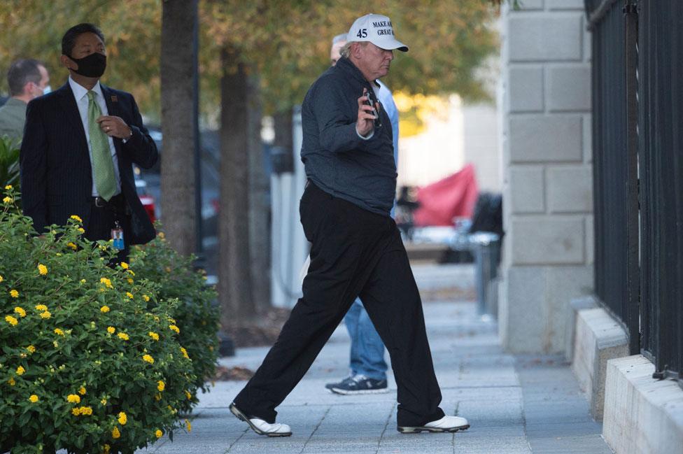 Trump arrives back at the White House after playing golf