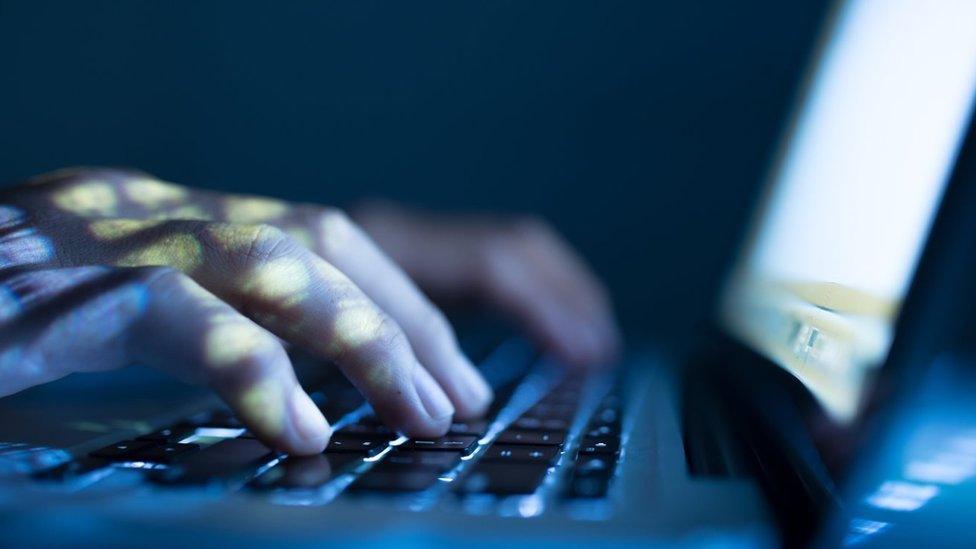 File photo showing person typing on a laptop keyboard.