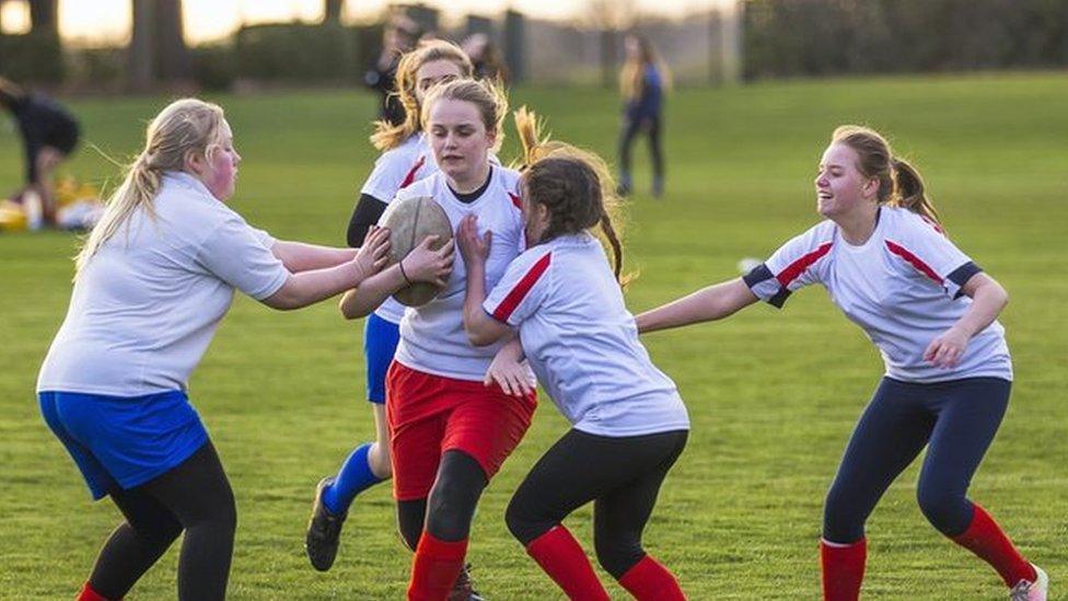 Girls playing rugby