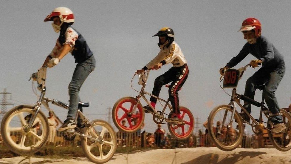 Children race on BMX tracks