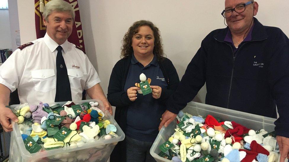 (L-R) Major Ian Davies, leader of the Salvation Army Wrexham, Karen Edwards and Peter Jones with knitted angels