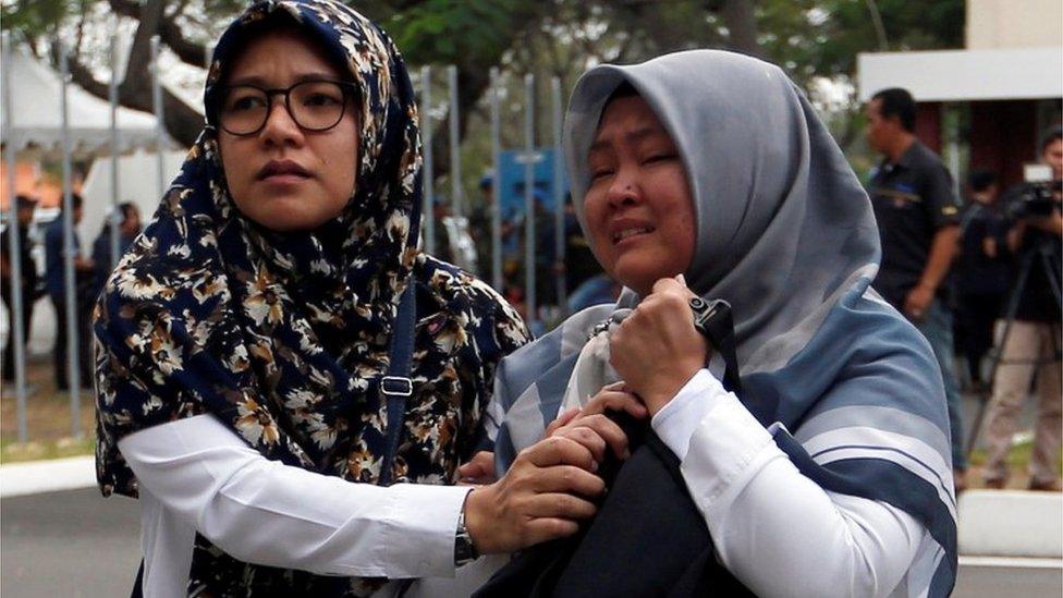 Two emotional women arrive at Soekarno Hatta International airport near Jakarta