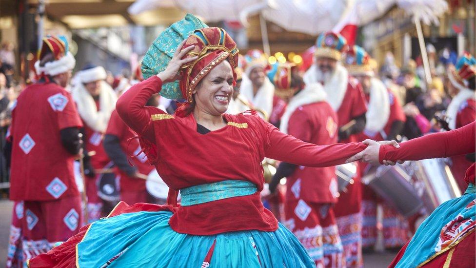 Woman dancing in parade